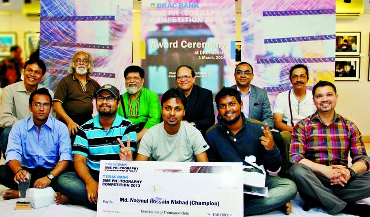 Winners of the photography competition at a photo session with Governor of Bangladesh Bank Dr Atiur Rahman and world renowned photographer Shahidul Alam at Drik Gallery.