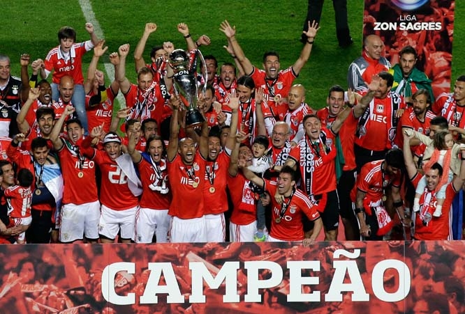 Benfica players celebrate with the trophy at the end of their Portuguese league soccer match with Olhanense on Sunday at Benfica's Luz stadium in Lisbon. Benfica defeated Olhanense 2-0 to win the championship with two rounds left to play.