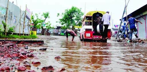 Due to lack of repairing and maintenance about three kilometers of road from Jatrabari to Demra Bridge became totally unfit for vehicular movement recently. This photo was taken on Sunday.