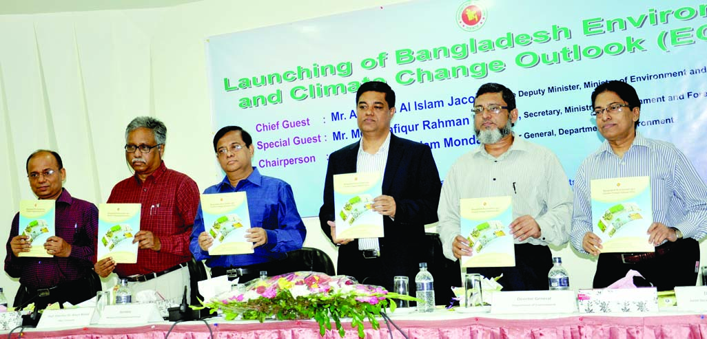 Participants hold the copies of report on 'Bangladesh Environment and Climate Change Outlook' at a ceremony organized by Forest and Environment Ministry at CIRDAP Auditorium in the city on Sunday.
