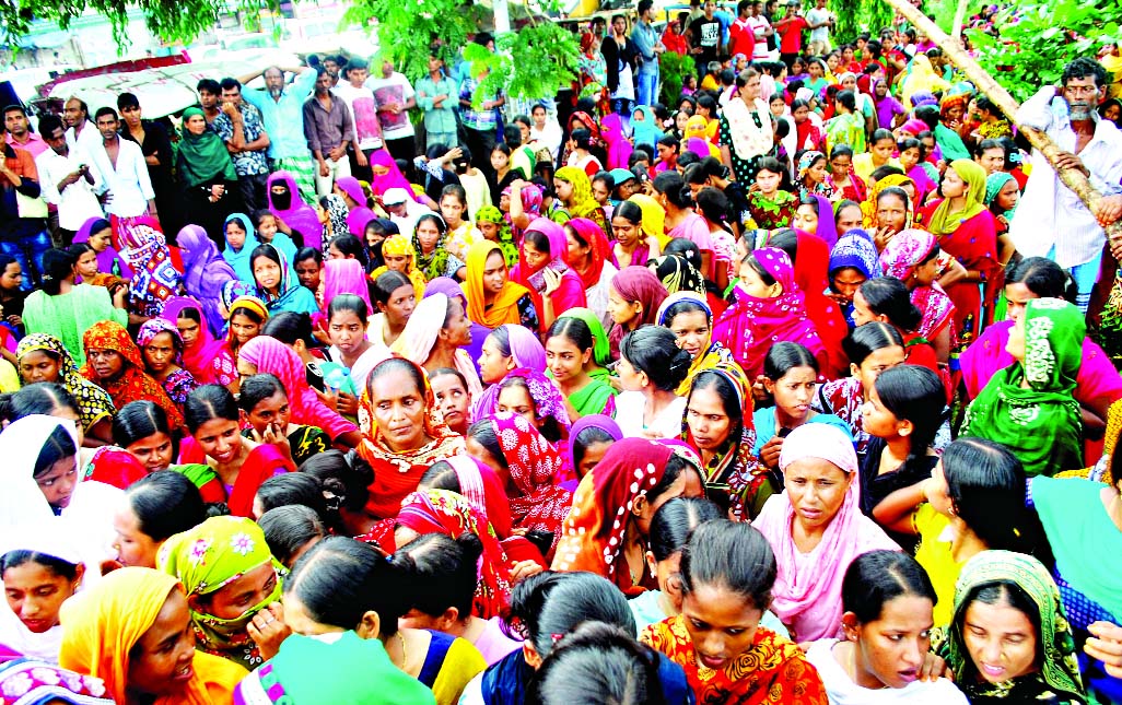 At least 682 Tuba Group workers waiting in queues to draw their July salary and overtime dues from BGMEA on Sunday.