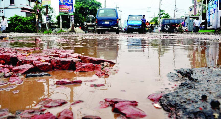 The busy Dhaka-Sylhet Highway is again in critical condition as potholes and cracks on the road have become reservoirs of rain waters. This part of the road was repaired just before the Eid-ul-Fitr. This photo was taken from Kazla area, outskirts of city