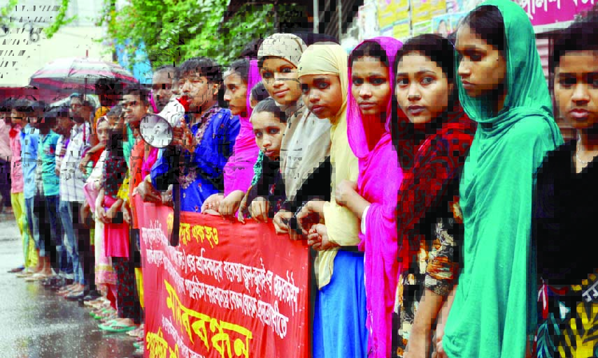 . Garments Sramik Sanghati Federation formed a human chain in front of the National Press Club on Saturday demanding payment of salary and festival bonus of all garments employees within September 25 next.