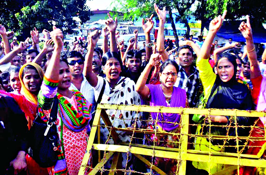 Workers of Mirpur's Dorin Fashions Limited demonstrate in front of BGMEA office in city to reopen the factory and demanded payment of arrear salary immediately. This photo was taken on Tuesday.