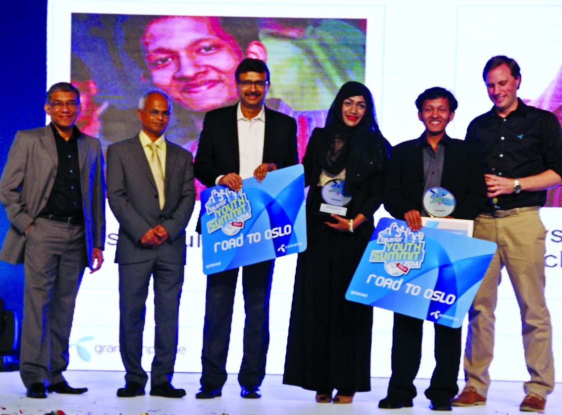 Education Secretary NI Khan distributing prizes between the winners of "Telenor Youth Summit 2014"" at a city hotel on Saturday. Grameenphone CEO Vivek Sood and Chief Human Resources Officer Quazi Mohammad Shahed were present."
