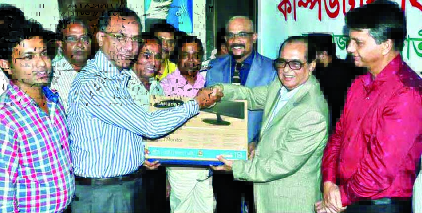 State Minister for Youth and Sports Biren Sikder, MP handing over computer to General Secretary of Narail District Sports Association Ashiqur Rahman Miku at the conference room of the National Sports Council on Wednesday. Deputy Minister for Youth and Spo