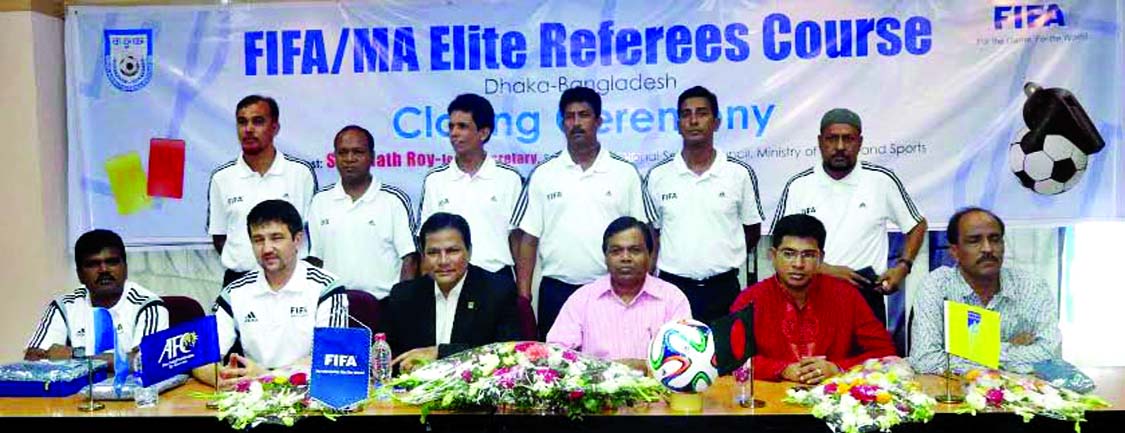 The participants of the FIFA/ MA Elite Referees Course and the instructors and the officials of Bangladesh Football Federation pose for a photo session at the BFF House on Friday.