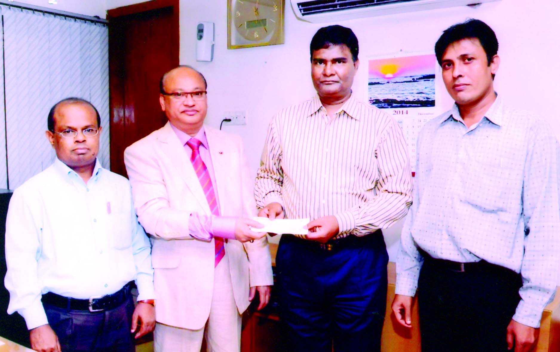 Abul Kalam Azad, Addl Managing Director of Crystal Insurance Company Limited, handing over fire insurance claim cheque to Amir Hamza, DGM of Rupali Bank Limited, Paltan branch recently as claim of Chowdhury Lather and Company.
