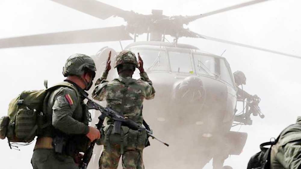 Columbian troops looking for the rebel's hideout. Agency photo