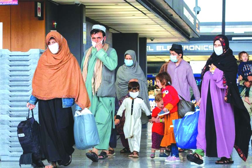 Families evacuated from Kabul arrive at Washington Dulles International Airport, in Virginia.