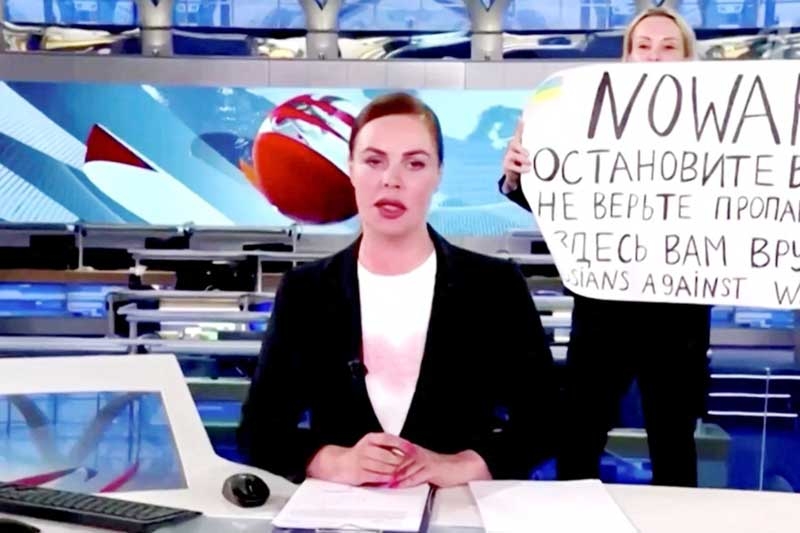 Marina Ovsyannikova interrupts a live news bulletin on Russian state TV in March shortly after the Ukraine invasion began. Agency photo