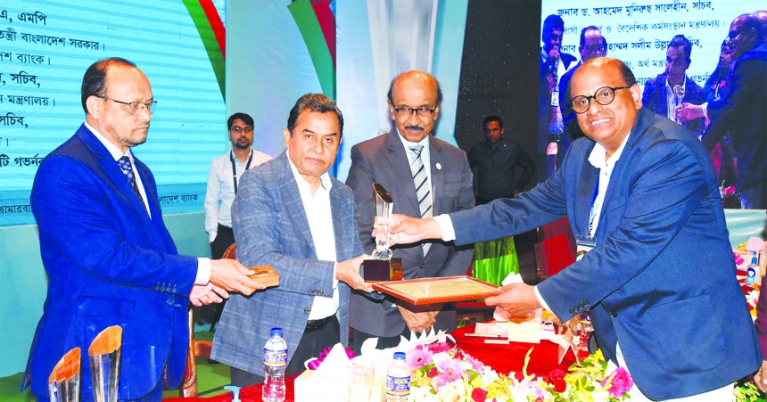 Sir Enamul Islam, Chairman of Mosabbir City, receiving the Bangladesh Bank Remittance Award 2019 & 2020 from Finance Minister A. H. M. Mustafa Kamal at a program held in Krishibid Institute in the capital on Thursday.