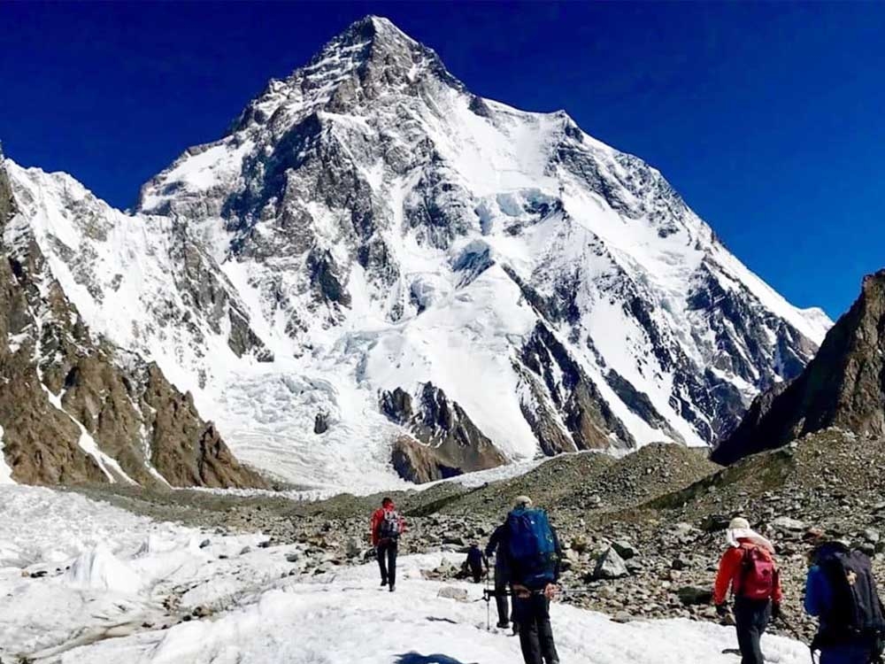 The climbers are walking to the mountains