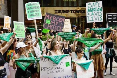 House Speaker Nancy Pelosi of Calif., accompanied by female House Democrats, speaks at an event ahead of a House vote on the Women's Health Protection Act and the Ensuring Women's Right to Reproductive Freedom Act at the Capitol in Washington on Friday.