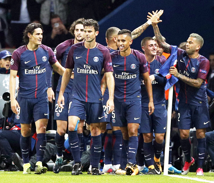 PSG players celebrate scoring their third goal during a Champions League Group B soccer match between Paris Saint-Germain and Bayern Munich at the Parc des Princes stadium in Paris, France on Wednesday.