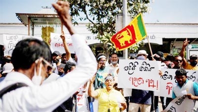 Protestors shout slogans during a protest demanding the resignation of Sri Lanka's acting President Ranil Wickremesinghe, in Colombo, Sri Lanka.
