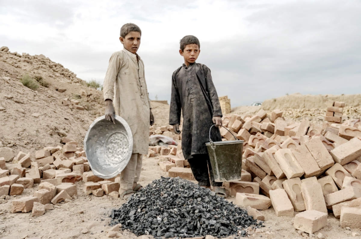 Children as young as four or five years old are working alongside with their families in the many brick factories on the highway north out of the capital. Agency photo