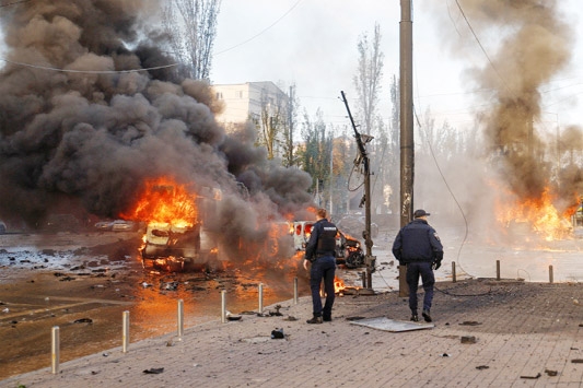 Cars are seen on fire after Russian missile strikes, as Russia's attack continues, in Kyiv, Ukraine on Monday.