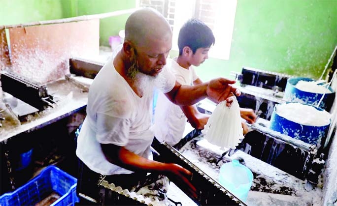 Manufacturers make candles at a factory in the capital on Monday ahead of demand of the people amid load-shedding that is prevalent across the country.