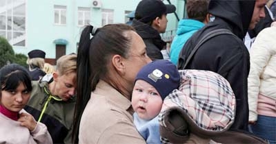 Civilians evacuated from the Russian-controlled Kherson region of Ukraine arrive at a railway station in the town of Dzhankoi, Crimea on Thursday.