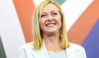 Meloni speaks to the media as she stands next to Berlusconi and Salvini in Rome on Friday.