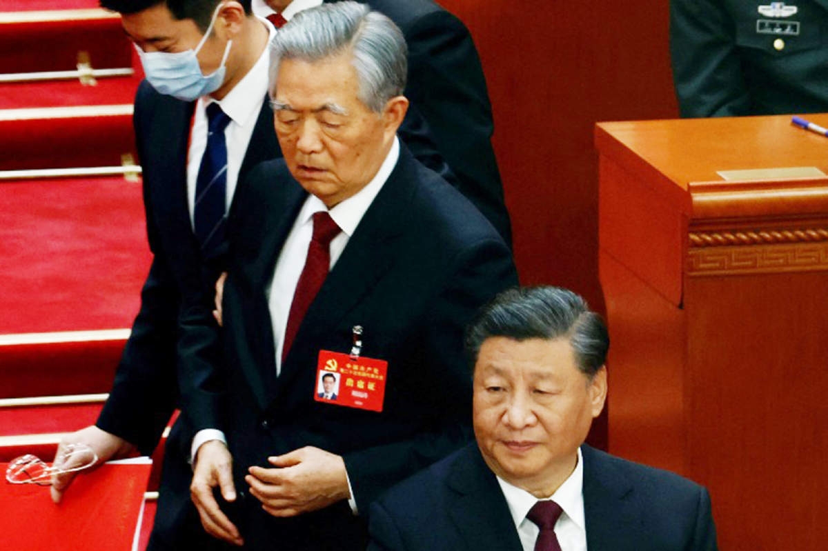 Former Chinese president Hu Jintao leaves his seat next to Chinese President Xi Jinping during the closing ceremony of the 20th National Congress of the Communist Party of China in Beijing on Saturday. Agency photo