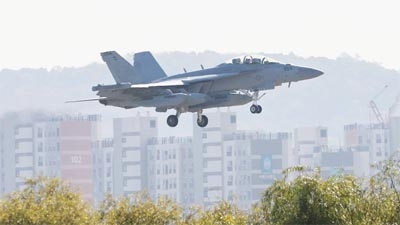 A US Air Force EA-18 Growler fighter jet flies on final to land at the Osan Air Base in Pyeongtaek on Friday, as South Korea and US agreed to extend a joint aerial drill called "Vigilant Storm".