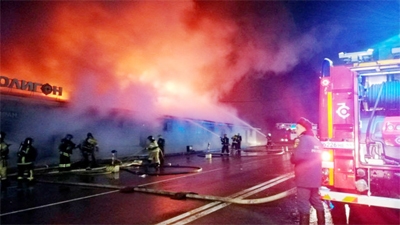 Firefighters work to extinguish a fire at a cafe in Kostroma, Russia on Saturday.