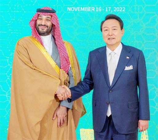 Crown Prince of Saudi Arabia, Mohammed bin Salman, on left, shakes hand with South Korea's President Yoon Suk-yeol, on right, as they pose for a photo, in Seoul, South Korea on Thursday.