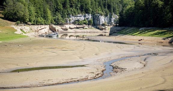 File Photo: The dry bed of Brenets Lake (Lac des Brenets), part of the Doubs River, a natural border between eastern France and western Switzerland, as much of Europe bakes in a third heatwave since June on August 4, 2022 Agency photo