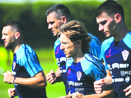 (Left to right) Croatia's Mateo Kovacic, Dejan Lovren, Luka Modric and Dominik Livakovic take part a training session at the team's Al Erssal training camp in Doha on Saturday.