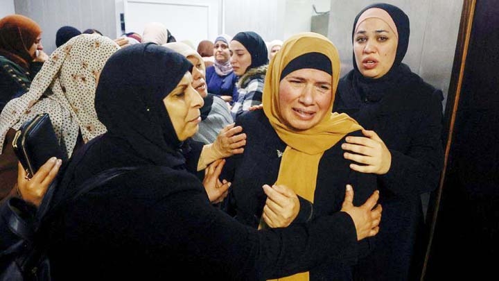 Relatives of deceased two brothers gathered at a hospital near Ramallah in the occupied West Bank, Palestine before their funeral on Tuesday. Agency photo