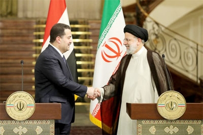 File photo: Iran's President Ebrahim Raisi and Iraq's Prime Minister Mohamed Shia al-Sudani shaking hands during a joint press conference in the capital Tehran on November 29, 2022.