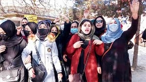 Afghan women chant slogans to protest against the ban on university education for women, in Kabul on Saturday.