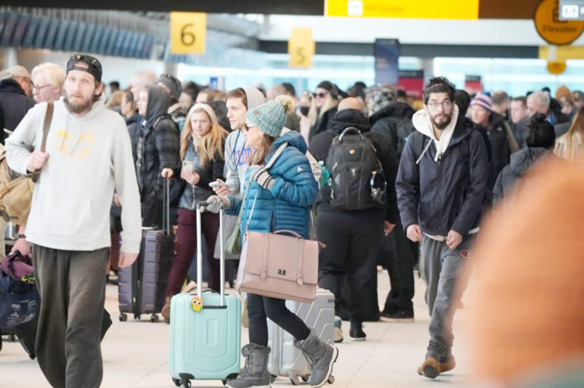 Travellers queue to check in at the Southwest Airlines counter in Denver International Airport after a winter storm swept over the US, creating chaos for people trying to reach their destinations on Monday. Agency photo