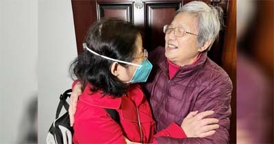 Chu Wenhong hugs her mother as she arrives from Singapore ahead of the Chinese Lunar New Year, her first time home since the coronavirus disease (Covid-19) pandemic, in Shanghai, China on Thursday.