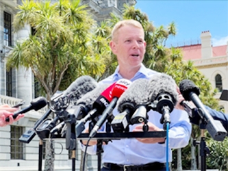 Chris Hipkins speaks to members of the media, after being confirmed as the only nomination to replace Jacinda Ardern as leader of the Labour Party, outside New Zealand's parliament in Wellington, New Zealand, on Saturday.