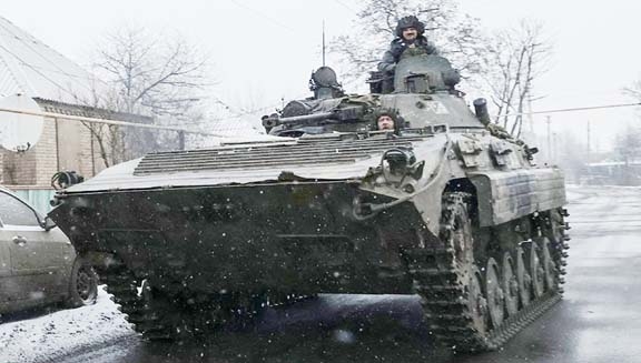 Ukrainian service members ride a BMP-2 infantry fighting vehicle, as Russia's attack on Ukraine continues, near the frontline town of Bakhmut, Donetsk region, Ukraine on Tuesday. Agency photo