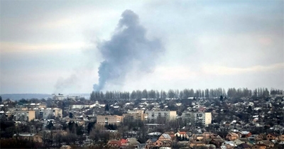 Law enforcement members gather next to the vehicle of the victim of a shooting outside a gas station convenience store in Arkabutla, Mississippi, US on Saturday.