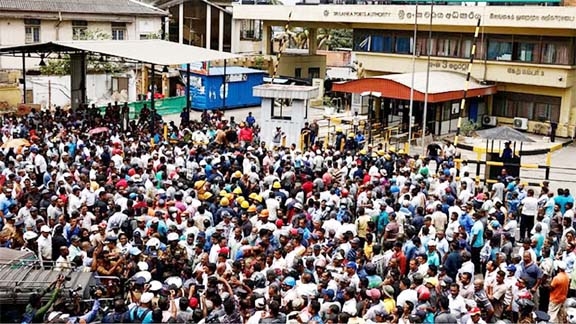 Colombo harbor union members protest during a strike against huge tax increase in Colombo, Sri Lanka on Wednesday. Agency photo