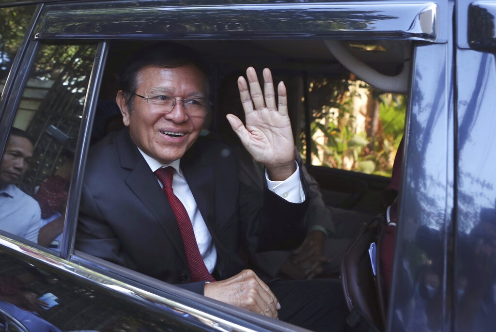 Former President of Cambodia National Rescue Party, Kem Sokha, waves from his car in front of his house in Phnom Penh, Cambodia, Friday, March 3, 2023.