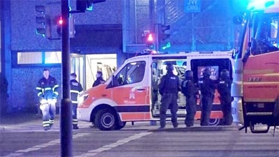 Emergency workers and police gather at the scene following a deadly shooting in Hamburg, Germany, on Thursday in this still image taken from video.