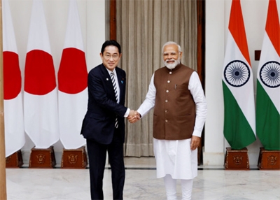 Japan Prime Minister Fumio Kishida shakes hands with his Indian counterpart Narendra Modi before their meeting at the Hyderabad House in New Delhi, India on Monday.