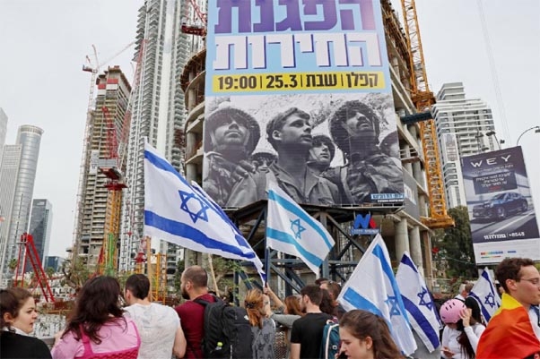 Protesters gather amid ongoing demonstrations against controversial legal reforms being touted by the country's hard-right government in Tel Aviv on Thursday.