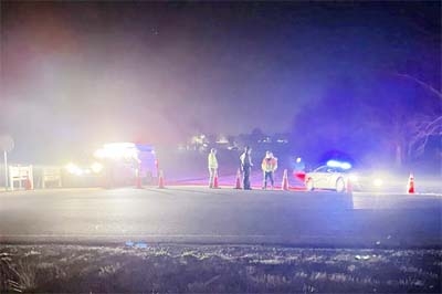 Emergency responders are seen near a site where two military helicopters crashed Wednesday night during a routine training mission in Trigg County, in southwestern Kentucky, on Thursday.