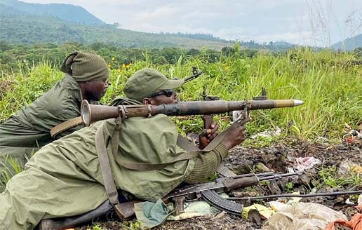Armed Forces of the Democratic Republic of the Congo (FARDC) soldiers take their position following renewed fighting near the Congolese border with Rwanda, outside Goma in the North Kivu province of the Democratic Republic of Congo on May 28, 2022.