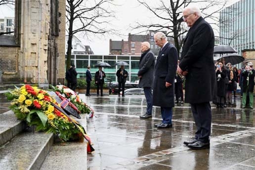 Britain's King Charles and German President Frank-Walter Steinmeier stand in front of wreaths at St. Nikolai church memorial dedicated to the victims of allied bombings during World War Two in Hamburg, Germany on Friday.