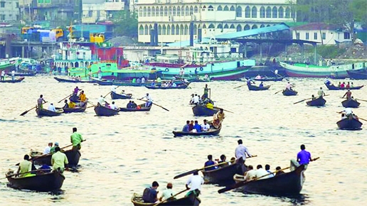 Boatmen carry passenger in small boats to move from one place to another by taking risks in the Buriganga River. This photo was taken on Saturday.