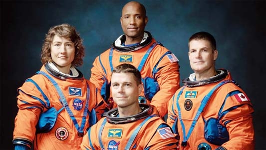 The Artemis II lunar flyby mission crew members include (from left): NASA astronauts Christina Koch, Victor Glover, Reid Wiseman (foreground) and Canadian Space Agency astronaut Jeremy Hansen. Agency photo