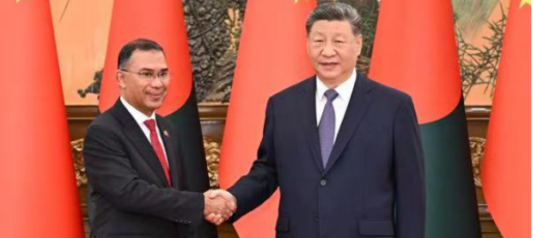 Bangladeshi and Chinese leaders shake hands in front of their national flags